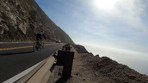 Cycling on a highway overlooking the Pacific