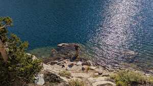 Two men standing in lake from above